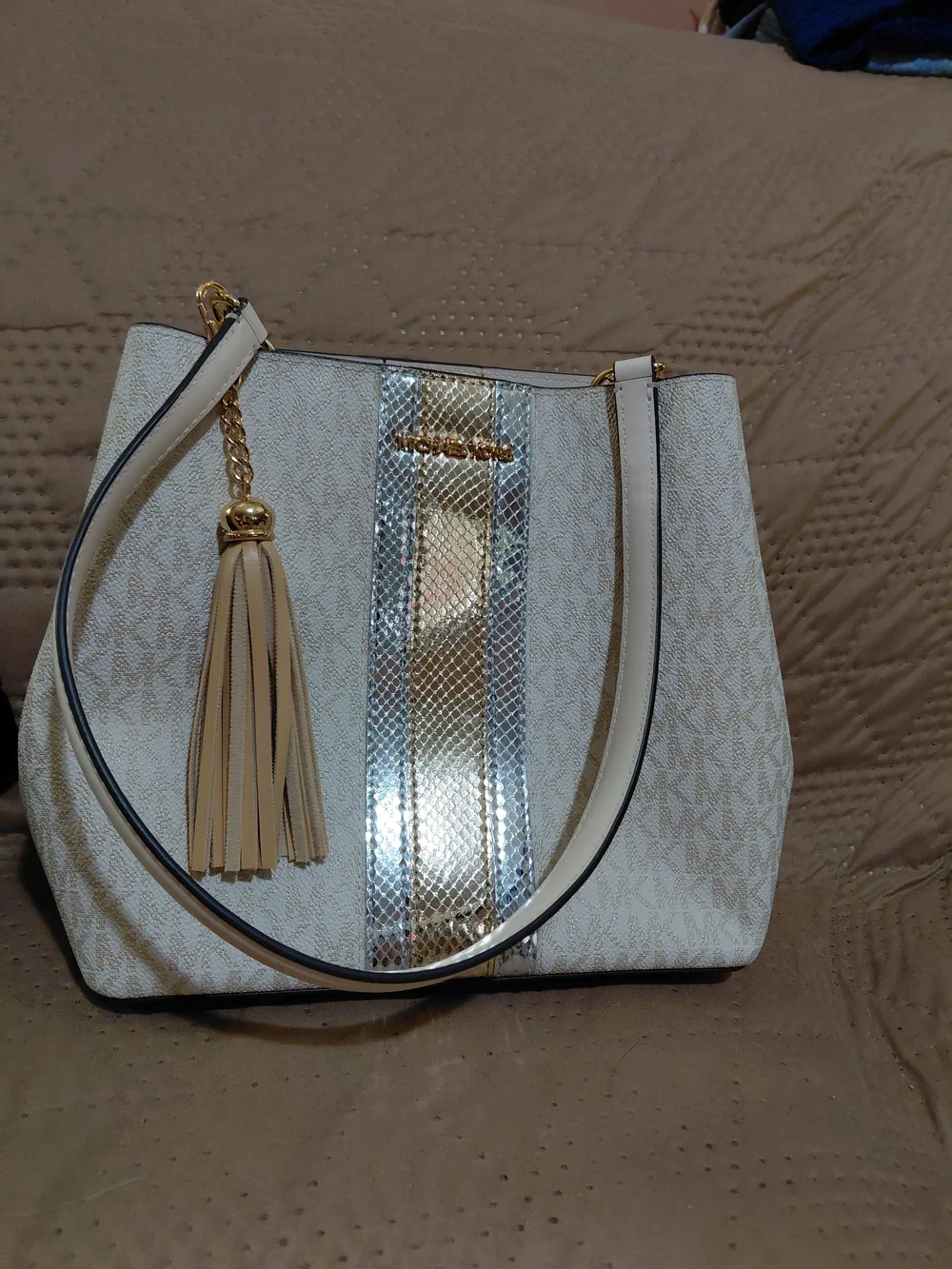 Michael Kors Cream Tote with Gold Metallic Accent and Tassel